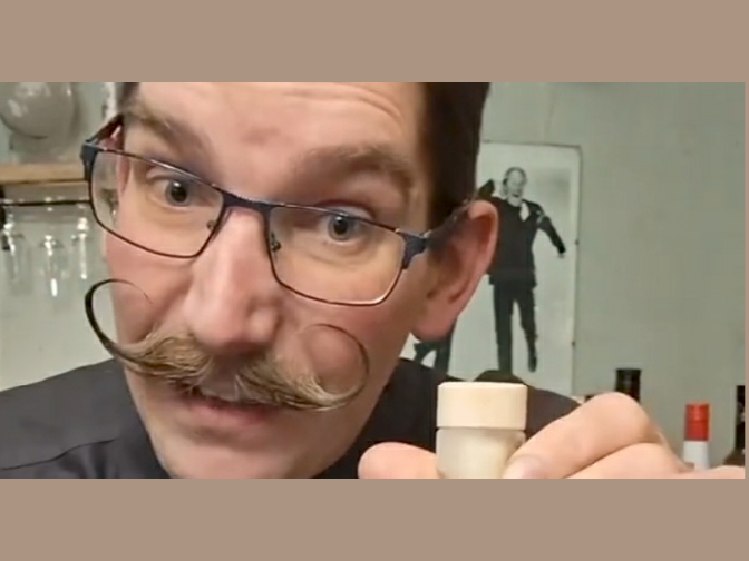 Close‑up of Chuckle Engine Botanical Vodka as the reviewer talks about flavour and smoothness